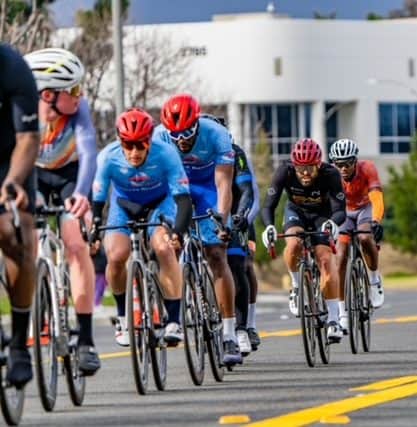 ispeed cyclists in race amongst a peloton of riders