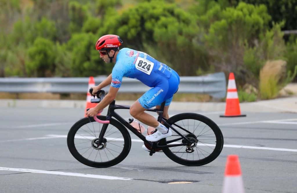 Jonathan with iSpeed Racing going around a bend in bike race