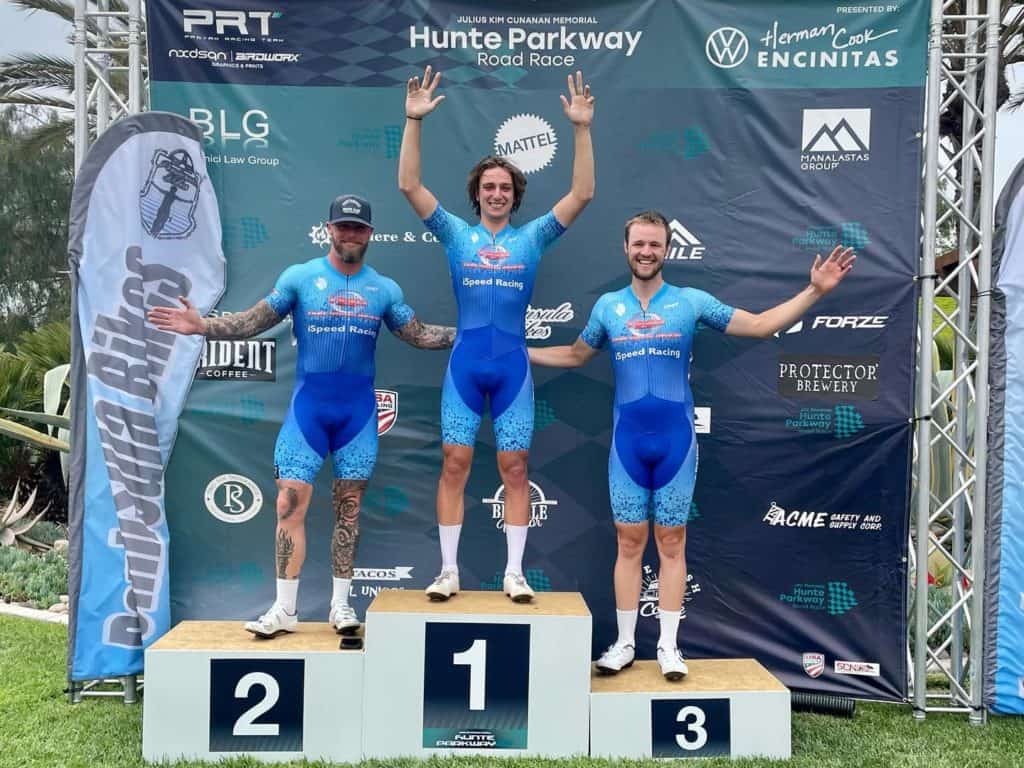 Adin, Kyle, and Thor on podium at bike race